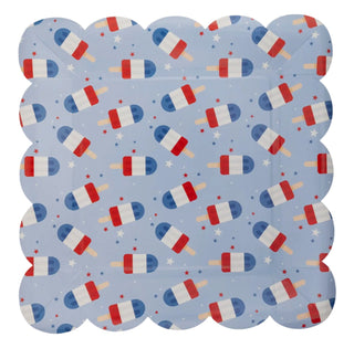 Pattern of blue and red pill capsules and stars on a My Mind's Eye Blue Popsicles Paper Plate background.