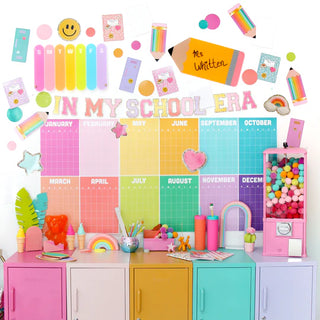 Colorful classroom display board labeled "In My School Era" with a monthly calendar, Giant School Themed Confetti by Kailo Chic, and a gumball machine placed on equally colorful lockers. Various school supplies are arranged on top for the perfect school event decoration.