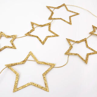 Gold Star Glitter GarlandThis beautiful and sparkly gold garland features an array of star pennants perfect for Christmas. The pennants are in three sizes all embellished with chunky gold glMeri Meri