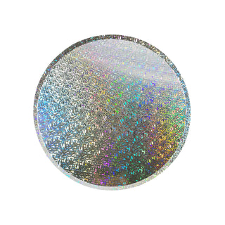 A glittering, multicolored circular disc imbued with a shimmering holographic effect that catches the light, creating a rainbow-like spectrum of vibrant hues on Loop by Frankie Iridescent Paper Plates.