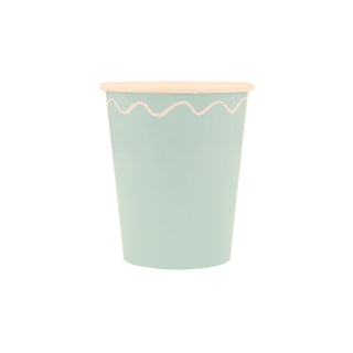 A blue and white Meri Meri Mixed Wavy Line Cup that is perfect for a party table.