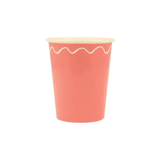 A Meri Meri Mixed Wavy Line Cup with a white rim, perfect for a party table.