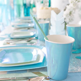 A pastel blue party table setting with coordinated Posh Bubble Mint Cups, plates, and luxe tableware from the Jollity & Co Collection, highlighting a minimalist and eco-friendly celebration theme.