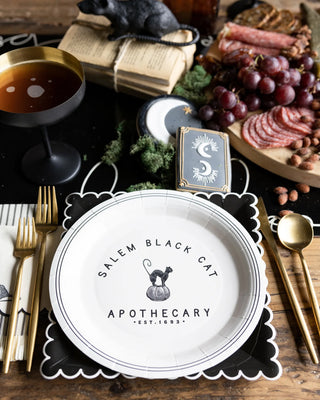 Salem Apothecary Cat PlateSet a spooky scene this Halloween with these Black Cat Apothecary party plates. These paper plates are dinner size plates, and feature a vintage apothecary inspired My Mind’s Eye