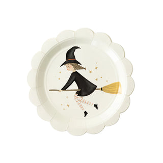 A whimsical Witches Paper Plate Set by My Mind’s Eye featuring a charming illustration of a witch riding a broomstick, surrounded by star accents, is perfect for Halloween party supplies. Each plate is set against a clean, white background.