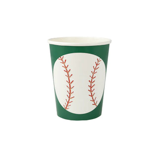 A disposable Meri Meri paper cup with a baseball design, featuring two red seams mimicking the stitching on a baseball, set against a white and green background.