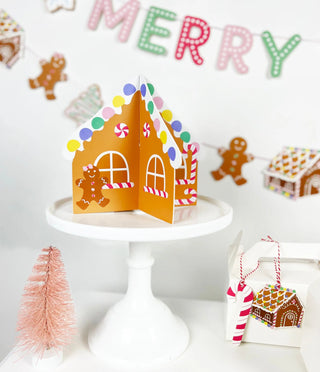 DIY Gingerbread HouseThis DIY gingerbread house craft kit makes a fun Holiday activity with kids. Decorate the blank gingerbread house with candy stickers. It makes a great centerpiece fMerrilulu