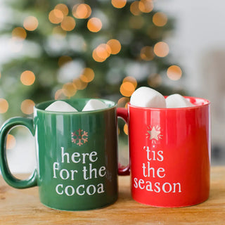 Festive Holiday Mugs• Includes 2 Christmas themed mugs: 1 green mug with written words ‘here for the cocoa’ and a Christmas tree star on top and 1 red mug with written words ‘tis the sePearhead