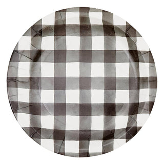 A round, checkered paper plate with a black and white grid pattern, suggesting a casual or festive Football Party in a Box - Tailgate occasion by Slant.