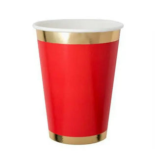 A luxe tableware piece, a Posh Ruby Kiss cup with metallic gold trim on the rim and base, typically used for casual events and celebrations by Jollity & Co.