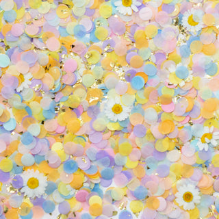 A vibrant assortment of pastel-colored confetti with occasional golden sparkles and miniature white flowers, all scattered in a joyful celebration backdrop.
