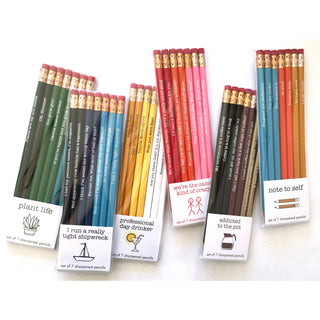 A collection of eight colorful pencil sets, each with a unique label and theme such as "plant life" or "addicted to the pod", arranged side by side against a white background.