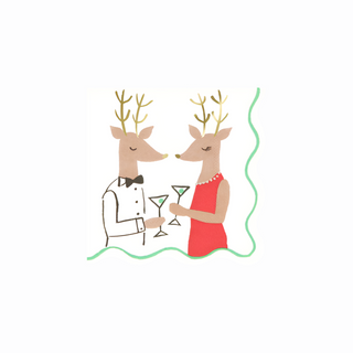 Description of the Mr. & Mrs. Reindeer Small Napkins by Meri Meri: An illustration featuring two elegantly dressed reindeer, each holding a martini glass and standing next to festive tableware. The reindeer on the left is adorned in a tuxedo, while the one on the right dons a red dress complemented by a pearl necklace.