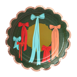 The Christmas Wreath Bows Large Disposable Plates by Paper Source feature colorful bows in shades of red, blue, and orange on a dark green background with a scalloped edge—perfect for adding charm to your holiday party.