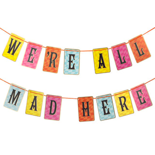 The Talking Tables Alice in Wonderland Multi Colored Double Sided Bunting features vibrant rectangular paper cards hanging in two rows, spelling out "WE'RE ALL MAD HERE," making it the perfect decoration for an Alice in Wonderland tea party.