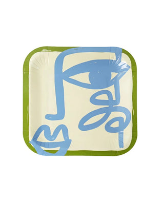 Art Party Dessert Plates crafted from sustainable FSC paper, adorned with a minimalist abstract face design in blue on a beige background, bordered by green trim. Perfect for those seeking stylish and eco-friendly small plates from Pop! Party Supplies.