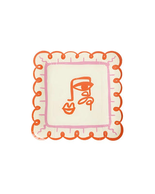 Square plate with a wavy, orange rim and an abstract, single-line face drawing in red on a creamy background, reminiscent of Art Party Dinner Plates by Pop! Party Supplies.