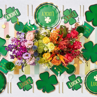 St. Patrick's Day table setting with elegant Die-Cut Shenanigans Plates and flowers for a holiday event by Sophistiplate.