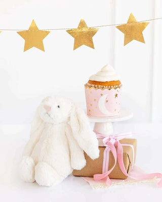 BABY PINK BAKING/TREAT CUPSOh baby! Get ready to doll up your baby girl's shower with these sweet food cups! With a timeless moon and stars pattern accented by gold foil, these cups are perfecMy Mind’s Eye