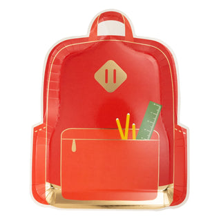 Red, paper picnic plates shaped like a school backpack, with a front pocket holding three yellow pens and a green ruler. Perfect for fun school lunches or outdoor events! Introducing the Backpack Plate Set by My Mind’s Eye.