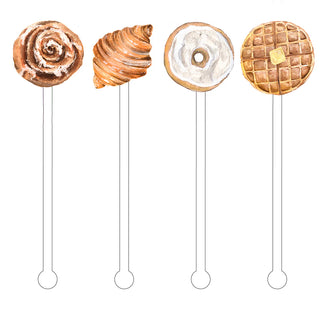 Illustration of the Breakfast Carbs Stir Sticks by Cami Monet, featuring four reusable stir sticks with designs of a cinnamon roll, croissant, frosted donut, and waffle with butter on top.