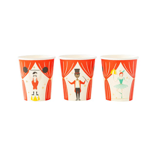 Three decorated Carnival Party Cups by My Mind’s Eye with circus-themed illustrations, including a strongman, ringmaster, and ballerina against red curtains—perfect for a carnival-themed birthday party or serving party punch.