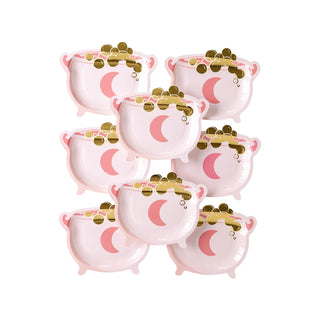 Eight Cauldron Shaped Plates by My Mind’s Eye, adorned with pink moons and gold coin decorations, are arranged in a grid pattern on a white background—perfect for serving spooky snacks at your Halloween party.