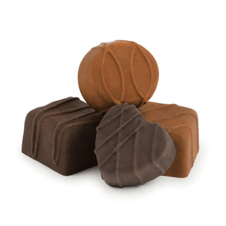 Displayed against a white background is a set of four assorted Fred and Friends Chocolate Erasers, consisting of a round, heart-shaped, and two rectangular pieces.