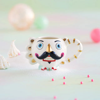 A Christmas Colonel Cupcake Mug with a Glitterville mustache.