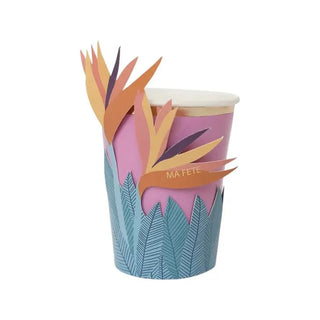 A Ma Fête paper cup adorned with a bird of paradise flower, perfect for a tropical theme party.