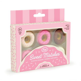 A pack of "Donut Erasers" by Fred and Friends, labeled "Sweet Mistakes," comes in pink, white, and brown colors. These BPA-free rubber erasers have a delightful vanilla scent and are recommended for ages 5 and up.