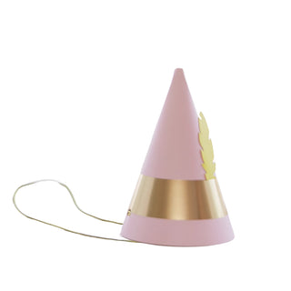 An Elf Party Hat from Bonjour Fête—featuring a pink cone shape with a gold band, a small gold feather decoration, and an elastic string for secure attachment—is the perfect accessory for your next Christmas party.