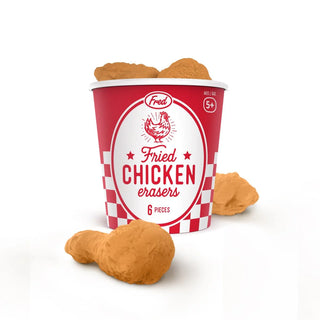 A bucket-shaped container, designed to look like one from a fried chicken restaurant and labeled "Fried Chicken Erasers" by Fred and Friends, includes four BPA-free TPR erasers that resemble fried chicken pieces.