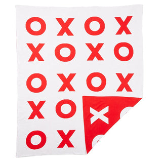 A cozy Reversible Luxe Throw - XO with red x's and o's, perfect for Valentine's Day by Creative Brands.