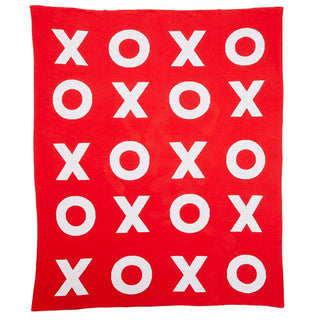 A cozy red blanket with white XO's, perfect for Valentine's Day.