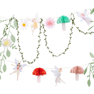 Introducing the Fairy Garland by Meri Meri: a decorative garland adorned with whimsical paper fairies, flowers, mushrooms, and leaves hanging in two enchanting rows—ideal for adding a touch of magic to your princess party décor.