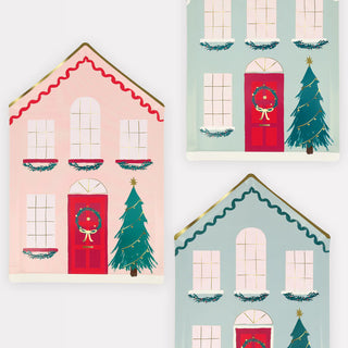 The Festive House Plates by Meri Meri feature three charming wintry houses, each with red doors, Christmas wreaths, and trees. The pink and teal houses are beautifully decorated with garlands, making them ideal for creating a delightful holiday atmosphere or inspiring your Christmas paper plate designs.