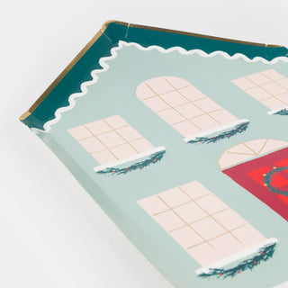 Introducing the Festive House Plates by Meri Meri, a set of charming house-shaped trays adorned with painted windows and a red door, ideal for serving your holiday meals. Each delightful piece is embellished with wintry wreaths, perfectly complementing your Christmas paper plate collection.