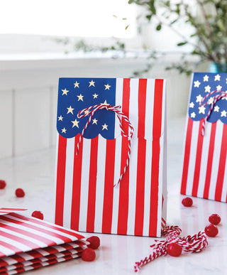 Celebrate the Fourth of July with these Flag Treat Bags adorned with red, white and blue ribbons from My Mind's Eye.