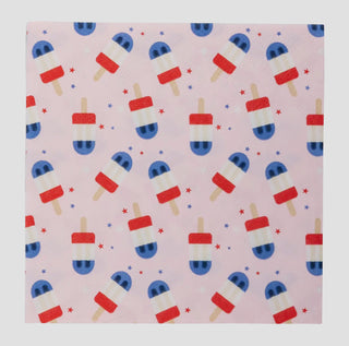 Popsicles Pattern Paper featuring a repeated design of red, white, and blue popsicles interspersed with small stars on a pink background from My Mind's Eye.