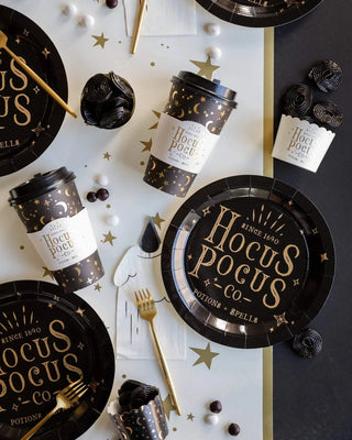 A black and Gold Foil Hocus Pocus Food Cups table setting with cups placed on plates by My Mind's Eye.