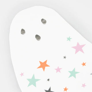 The Ghost With Stars Napkins by Meri Meri feature a white ghost-shaped illustration with black eyes and a mouth, adorned with pastel and neon stars in shades of pink, green, orange, and black.