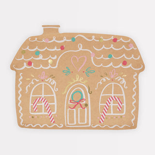 Meri Meri's Gingerbread House Plates feature charming illustrations of a gingerbread house adorned with candy cane decorations, a heart above the door, and vibrant icing details against a light brown backdrop, making them perfect for enhancing any festive Christmas party display.