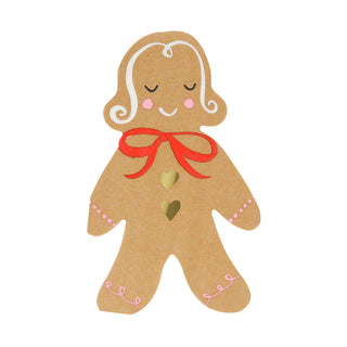 The Gingerbread Napkins by Meri Meri feature a gingerbread person design with closed eyes, a red bow around its neck, two heart-shaped buttons on its chest, and shimmering gold foil details.