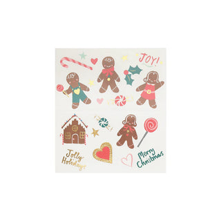 Introducing the Gingerbread Temporary Tattoos by Meri Meri: A festive collection featuring gingerbread people, candy canes, a gingerbread house, hearts, stars, and cheerful text that reads "Jolly Holidays!" and "Merry Christmas." Perfect as party favors or Christmas accessories.