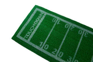 This green rectangular mat, designed to resemble a football field with yard markings from 10 to 40 and "Touchdown" at one end, makes the perfect **Grass Football Table Runner** by **Talking Tables** for any football party. Ideal for Super Bowl parties, it adds an authentic sporty touch to your gathering.