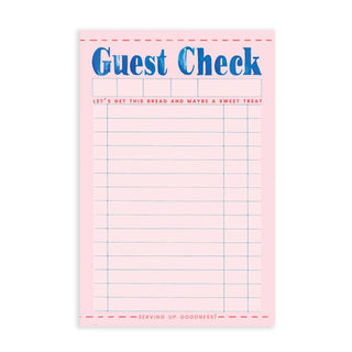 The Guest Check Diner Notepad by Cami Monet is designed to resemble a pink guest check with blue text reading "Guest Check" at the top. This diner-themed notepad includes blank lines for writing and playful phrases like "Let's get this bread and maybe a sweet treat" and "Serving up goodness!