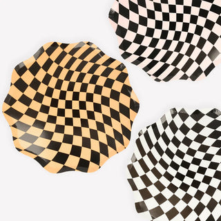 Halloween Checker Dinner PlatesCheck out these groovy Halloween plates! The combination of orange, white and pink, with a swirling checkered pattern, gives a fabulous 60s psychedelic vibe. They'reMeri Meri