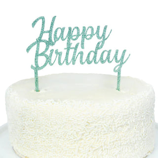 A white cake with white sprinkles is topped with a Merrilulu Happy Birthday Green Acrylic Topper.