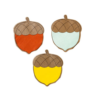 The Harvest Acorn Shaped Cocktail Napkin Set by My Mind’s Eye features three acorn-shaped napkins with bottoms in different colors: one orange, one light blue, and one yellow, perfect for adding charm to your Thanksgiving table.